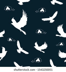 
Seamless pattern: silhouette of a hawk in white and bird's nests on a blue background. vector. illustration