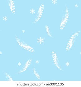 Seamless pattern with silhouetted bird's feathers and snowflakes on a light blue background