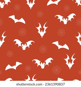 Seamless pattern of silhouettes of bats with cobwebs on an orange background. Halloween seamless pattern. Cute autumn design. Scary holiday horror sketch. Magic print for Halloween