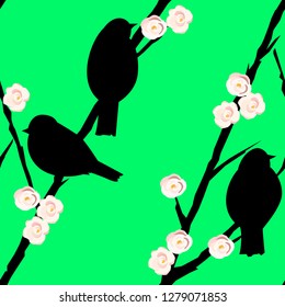 Seamless pattern with silhouettes of birds on the branches