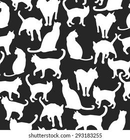 Seamless pattern with silhouettes of cats. Vector illustration