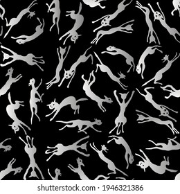Seamless pattern of silhouettes jumping and running cats