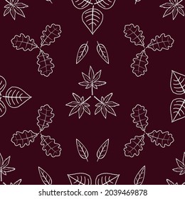 Seamless pattern of silhouettes of leaves on a dark background.