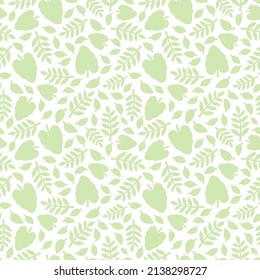 Seamless pattern with silhouettes of leaves on a white background. 