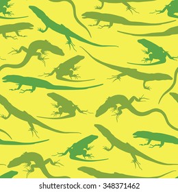 Seamless pattern silhouettes of lizards on a yellow background. Vector illustration
