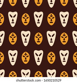 Seamless pattern with silhouettes of masks. Australian, african aboriginal culture. Tribal ethnic seamless background. Isolated on brown background. Hand drawn. Vector color illustration.