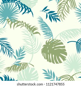 seamless pattern with silhouettes of palm leaves