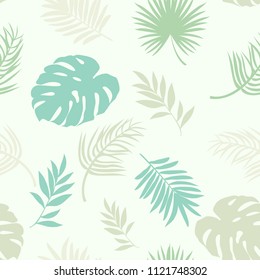 seamless pattern with silhouettes of palm leaves