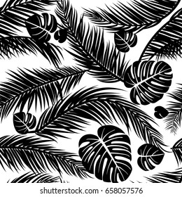 Seamless pattern with silhouettes of palm tree leaves in black on white background.Seamless Floral Background. Vector illustration