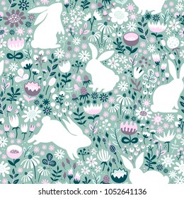 Seamless pattern from silhouettes of rabbits and wildflowers.Hand-drawn vector texture