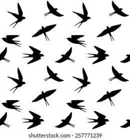 Seamless pattern with silhouettes of spring birds