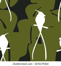 Seamless pattern with silhouettes of tropical leaves and humming birds. Jungle vector illustration design for fabrics, wallpapers.