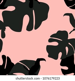 Seamless pattern with silhouettes of tropical leaves and toucans. Jungle vector illustration design for fabrics, wallpapers.