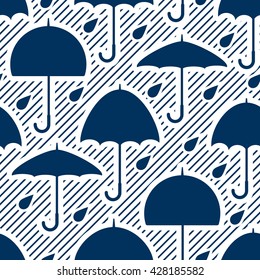 Seamless pattern with silhouettes of umbrellas and raindrops in diagonal striped background.