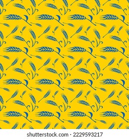 Seamless pattern with silhouettes of wheat ears in Ukrainian flag colors yellow and blue