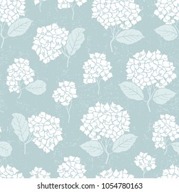 Seamless pattern of silhouettes with white Hydrangea, leaves and branches. Vector floral illustration on turquoise color background.