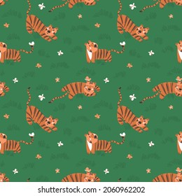Seamless pattern with simple cute tiger cubs and butterflies on a green grass background. Children's clothing design. Symbol of the year. Flat vector illustration.