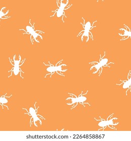 Seamless pattern with simple silhouettes of stag beetles,