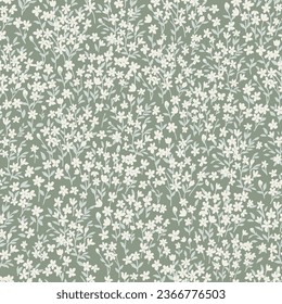 Seamless pattern with simple white flowers and light green leaves on long stems. Cute spring floral print with painted small flowers and leaves on a light green background.