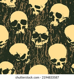 Seamless pattern with sinister human skulls on background of stone texture. Monochrome vector background with realistic skulls and paint spots in grunge style. Graphic print for wallpaper, wrappin