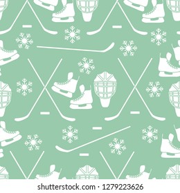 Seamless pattern with skates, goalkeeper mask, hockey stick, ice hockey puck, snowflakes. Winter sports background. Hockey equipment. Games, hobbies, entertainment.