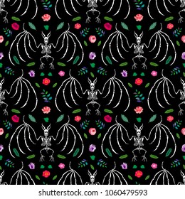 Seamless pattern. A skeleton of a bat among flowers. Isolated on a black background. Great for tattoo or print on a T-shirt. Ideal for decoration of Halloween and the Day of the Dead.