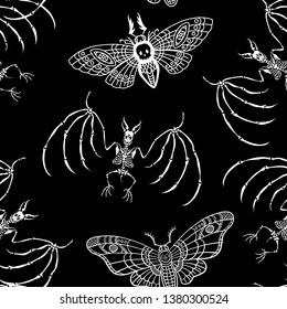 Seamless pattern. Skeleton of a bat and Dead head moth. Black and white ornament. Halloween illustration.