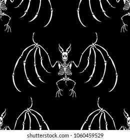 Seamless pattern. A skeleton of a vampire bat. Isolated on a black background. Great for tattoo or print on a T-shirt. Ideal for decoration of Halloween and the Day of the Dead.