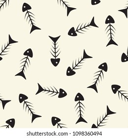 Seamless pattern from skeletons of fish on a light background