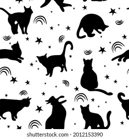Seamless pattern with sketch cats among stars.Black kittens silhouettes.Feline in different poses.Animals sit, lay,relax.Childish monochrome print,wrapping paper.Modern drawing with domestic pet.