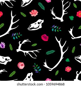 Seamless pattern. The skull and antlers of the deer are among the flowers. Blooming garden and hunting trophies. Great for print on a T-shirt. Ideal for decoration of Halloween and the Day of the Dead