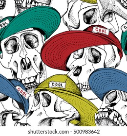 Seamless pattern. Skull of monkey in a color cap on a white background. Vector illustration.