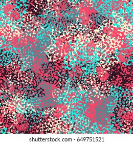 Seamless pattern. The skull on the background of a camouflage pattern. Brutal background. Pink, blue, purple, beige.