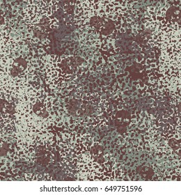 Seamless pattern. The skull on the background of a camouflage pattern. Brutal background. Brown, beige, gray-green.
