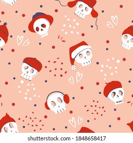 Seamless pattern with skull wearing various red hats on pink background