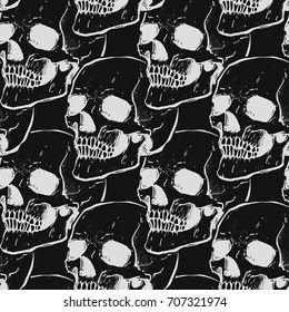 Seamless pattern with skulls. Black and gray colors. Grunge style. Repeating background. 