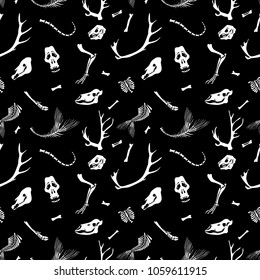 Seamless pattern. Skulls and bones of different animals. Great for tattoo or print on a T-shirt. Ideal for decoration of Halloween and the Day of the Dead.