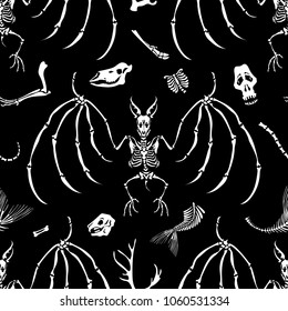 Seamless pattern. Skulls and bones of different animals and skeletons of vampire bats. Great for tattoo or print on a T-shirt. Ideal for decoration of Halloween and the Day of the Dead.