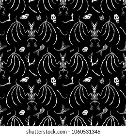 Seamless pattern. Skulls and bones of different animals and skeletons of bats. Great for tattoo or print on a T-shirt. Ideal for decoration of Halloween and the Day of the Dead.