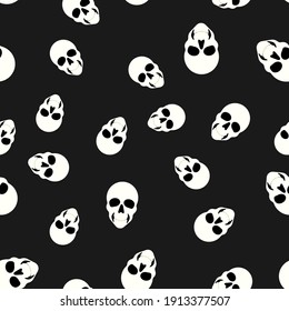 Seamless pattern with skulls on black background. vector illustration