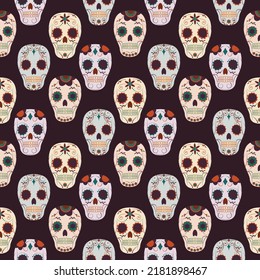 seamless pattern with skulls painted by flowers