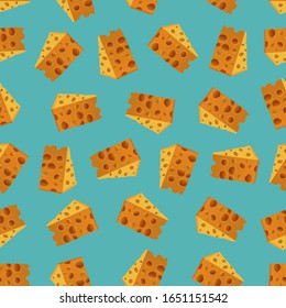Seamless pattern with a slices of cheese on a blue background. Cheeses pattern design. Cheeses slice background