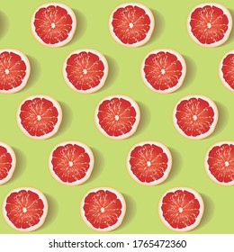Seamless pattern with slices of red juicy grapefruit on a bright green background. Background for the design of wallpaper, fabric and other. Vector illustration ready for print.