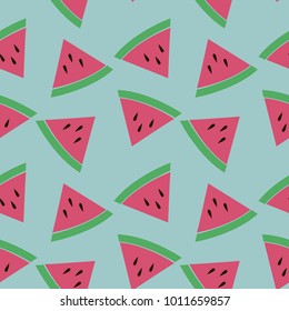 Seamless pattern with slices of watermelon in bright colors on the blue background. Vector.