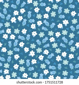 Seamless pattern with small blooming flowers and leaves on dark blue background. Perfect for wallpaper, gift paper, spring and summer greeting cards.