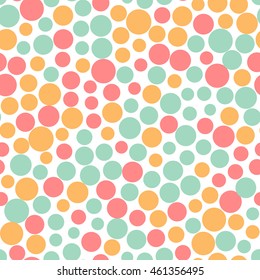 Seamless pattern with small colorful dots on a white background