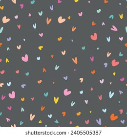 Seamless pattern with small colorful hearts on dark background, Valentines day pattern. Vector.