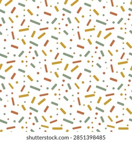 A seamless pattern of small dots and short, rectangular shapes in muted earthy tones of rust, mustard yellow, and sage green on a white background. The design is playful and abstract.