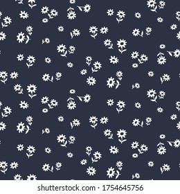 Seamless pattern of small flowers on black. Floral vector background