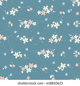 Seamless pattern with small flowers on on turquoise background. Spring light airy texture. vector.